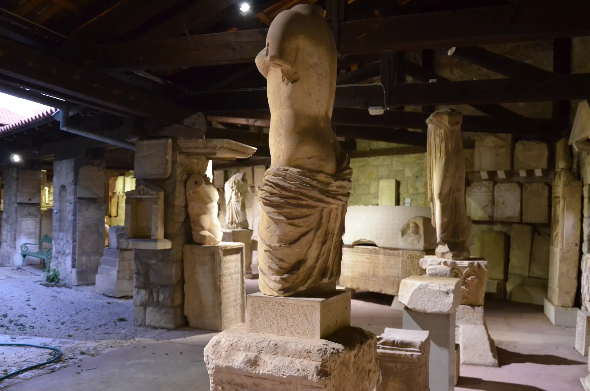 white stone body sculptures in museum