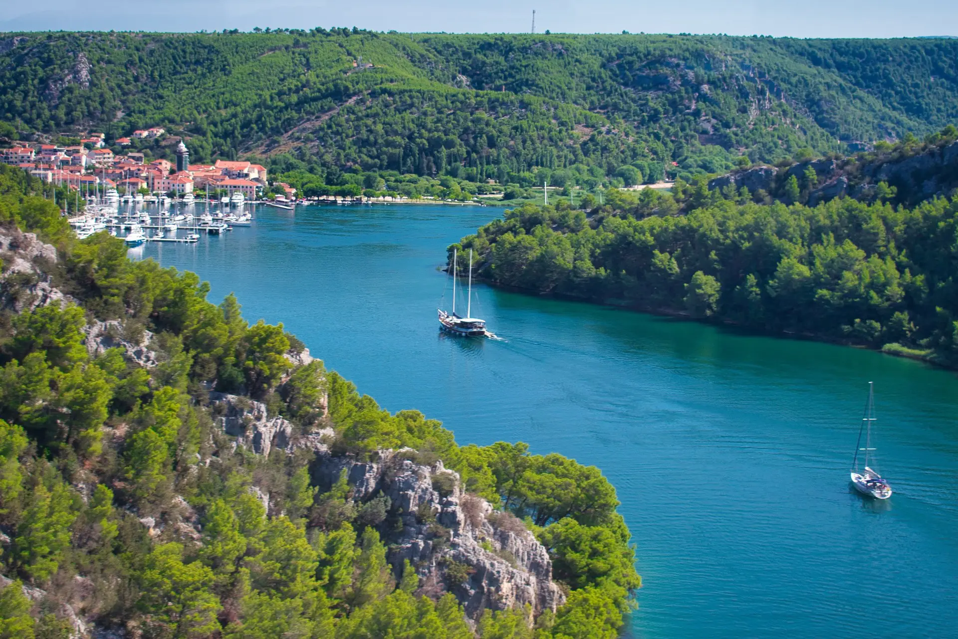 bay with boats and surounded by woods