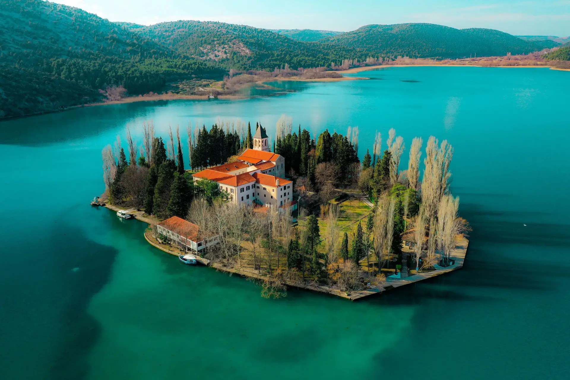 small island with monastery in the center of a lake